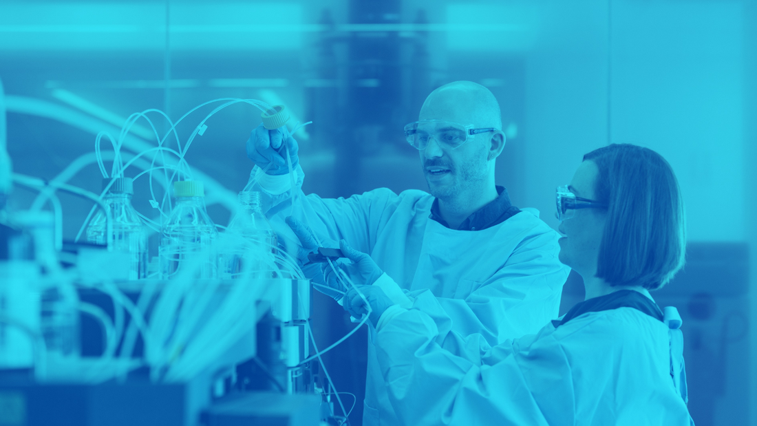 Blue image of two scientists analyzing diabetes data