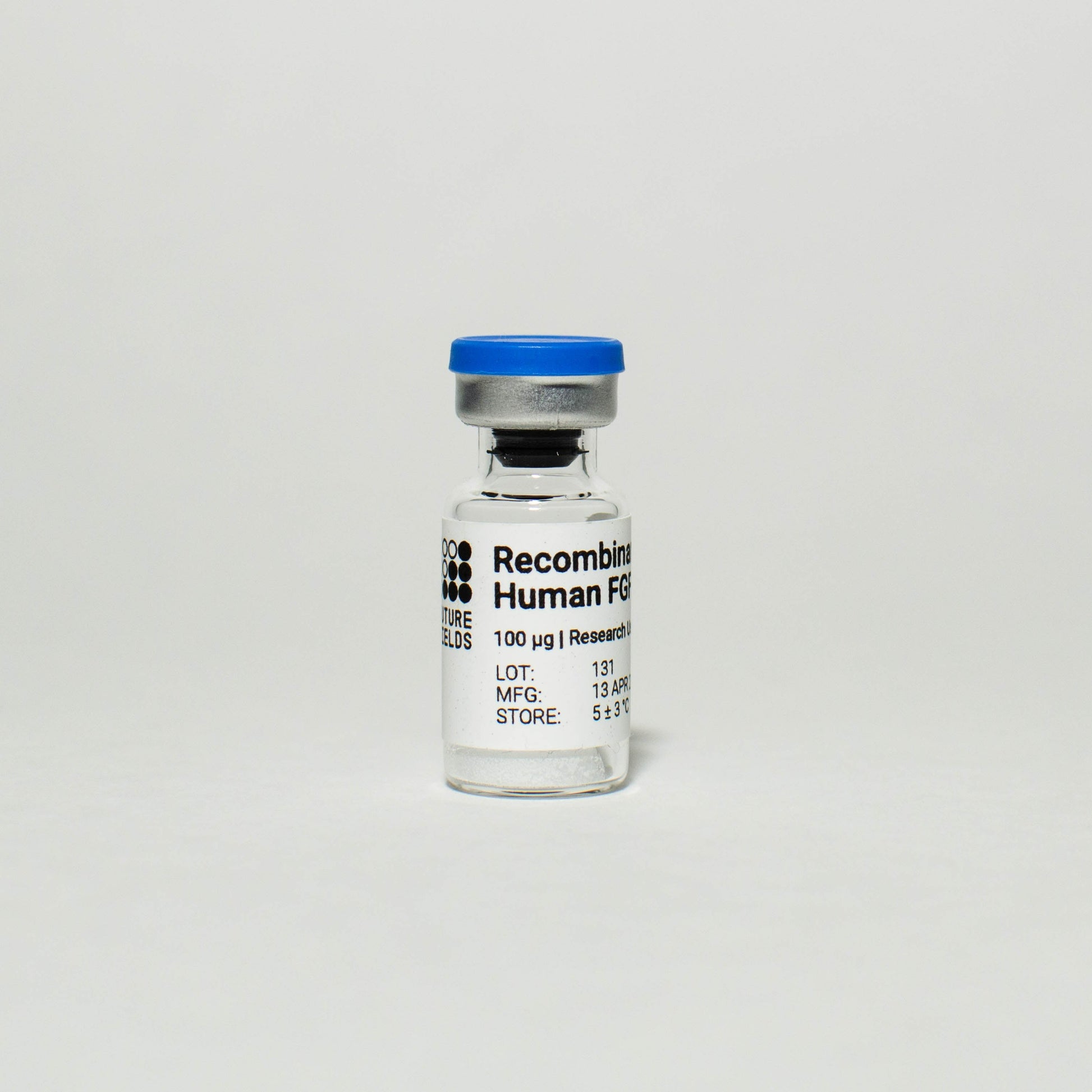 Photograph of a small vial with a white label that reads "Recombinant Human FGF2", product info, and the Future Fields logo. Future Fields Recombinant Human FGF2 is an active FGF2 growth factor produced with the EntoEngine™ platform.